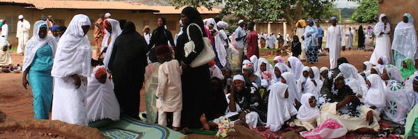 Women and children get ready to start prayer at a conservative Eid al-Fitr celebration.